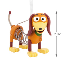 Load image into Gallery viewer, Toy figure of a dog with a spring, resembling Slinky from Toy Story, with dimensions indicated.