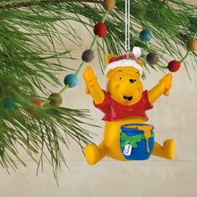 Load image into Gallery viewer, Christmas ornament of a bear character with a Santa hat on a tree branch.