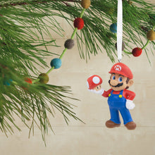 Load image into Gallery viewer, Super Mario ornament hanging on a Christmas tree branch with colorful berries.