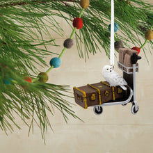 Load image into Gallery viewer, Harry Potter Christmas ornament with owl on a luggage cart and suitcases, hanging from a tree.