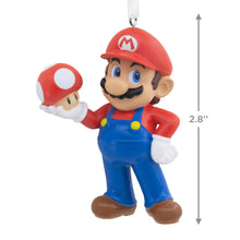 Load image into Gallery viewer, Decorative ornament of a character in red cap and blue overalls holding a red mushroom, with dimensions indicated.