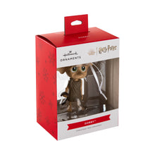 Load image into Gallery viewer, Packaged Christmas ornament of Dobby from Harry Potter with red box and visible brand logos.
