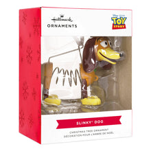 Load image into Gallery viewer, Slinky Dog Christmas tree ornament in packaging with Hallmark and Toy Story logos.