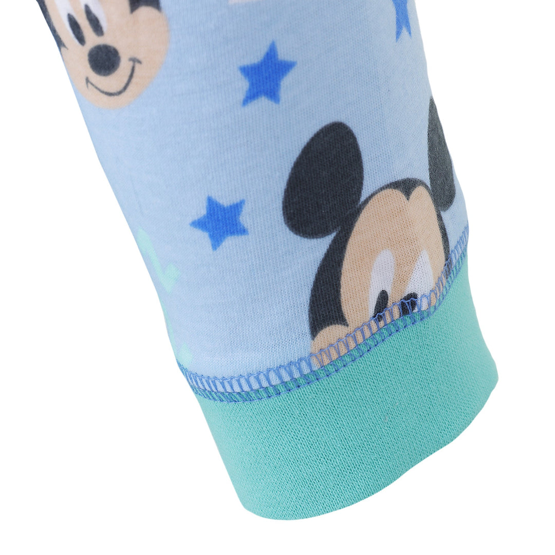 Light blue sock with cartoon character and blue stars on a white background