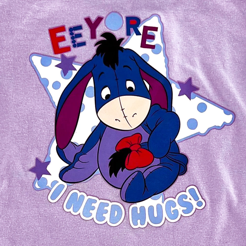 Disney Eeyore Baby Toddler Outfit Pyjamas daywear close up Cartoon character on a purple shirt with text 'Eeyore I Need Hugs' on a star background