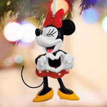 Load image into Gallery viewer, Decorative ornament of a cartoon character with a heart, against a blurred festive background.

