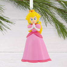 Load image into Gallery viewer, Princess Peach figurine ornament on a white background with greenery
