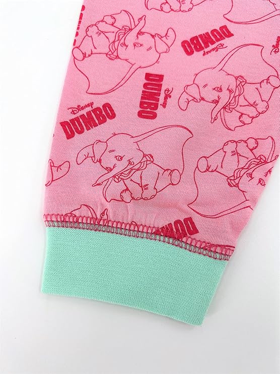 Pink fabric with Dumbo character print and green hem on a white background