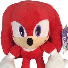 Load image into Gallery viewer, Sonic Friends Knuckles Red plush toy with a white face and black nose, featuring a visible tag. close up
