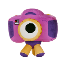 Load image into Gallery viewer, Snappy plush toy from Toy Story 5 a camera, featuring a pink body, purple accents, a large white and yellow eye, and small yellow legs, shown against a plain white background.
