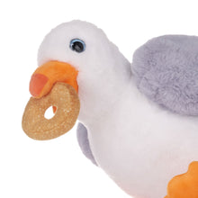 Load image into Gallery viewer, Close up of Plush toy seagull holding a donut on a white background
