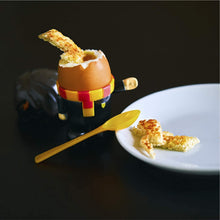 Load image into Gallery viewer, Harry Potter Egg Cup and Toast Cutter with egg in cup and toast on plate and toast dippnig ineg, spoon on side
