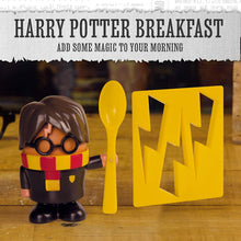 Load image into Gallery viewer, Harry Potter Egg Cup and Toast Cutter sitting on brown table with words above Harry Potter Breakfast
