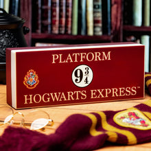 Load image into Gallery viewer, Hogwarts Express Platform Light sitting on table with Harry Potter glasses and scarf
